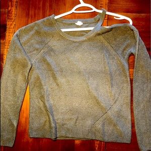 A knit pale green sweater